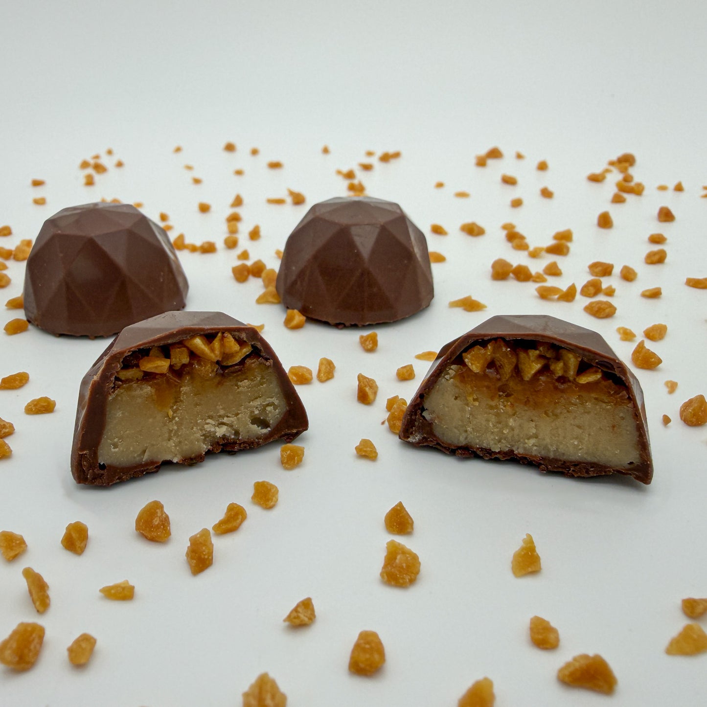 Chocolate Brilliant Truffles with a Caramel and Brown Sugar center on a white background